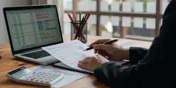 Person organizing financial documents for 2026 HSA contributions