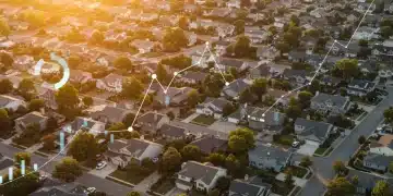 Diverse suburban neighborhood with houses and green lawns, symbolizing the broad reach of federal housing initiatives.